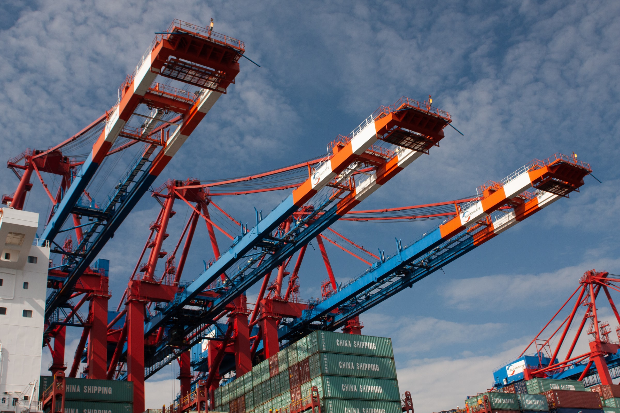 Black and white cranes at shipping port